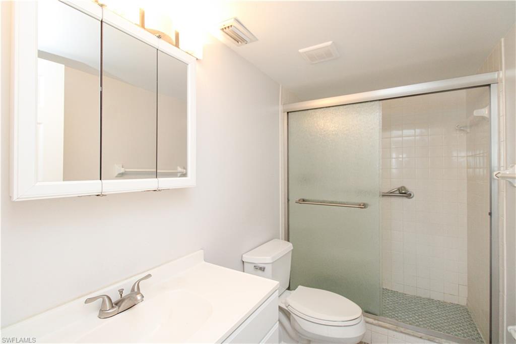 5635 Rattlesnake Hammock Road, Unit 102D Naples, FL 34113 - Photo 39 of 47 a bathroom with a sink and a mirror