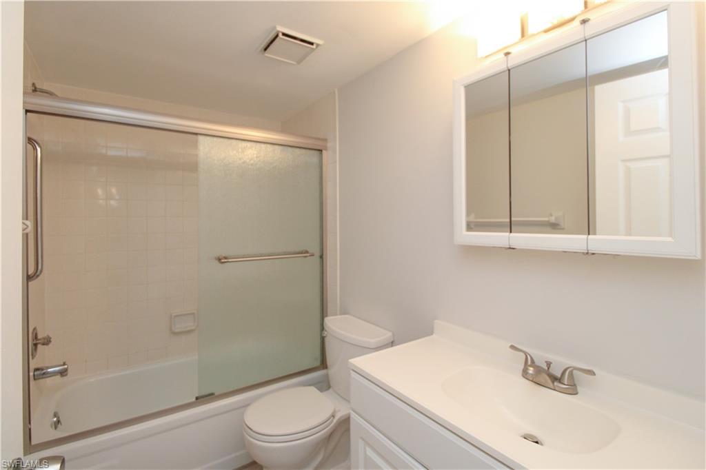 5635 Rattlesnake Hammock Road, Unit 102D Naples, FL 34113 - Photo 40 of 47 a bathroom with a sink and a mirror