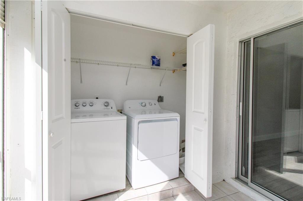 5635 Rattlesnake Hammock Road, Unit 102D Naples, FL 34113 - Photo 43 of 47 a utility room with dryer and washer