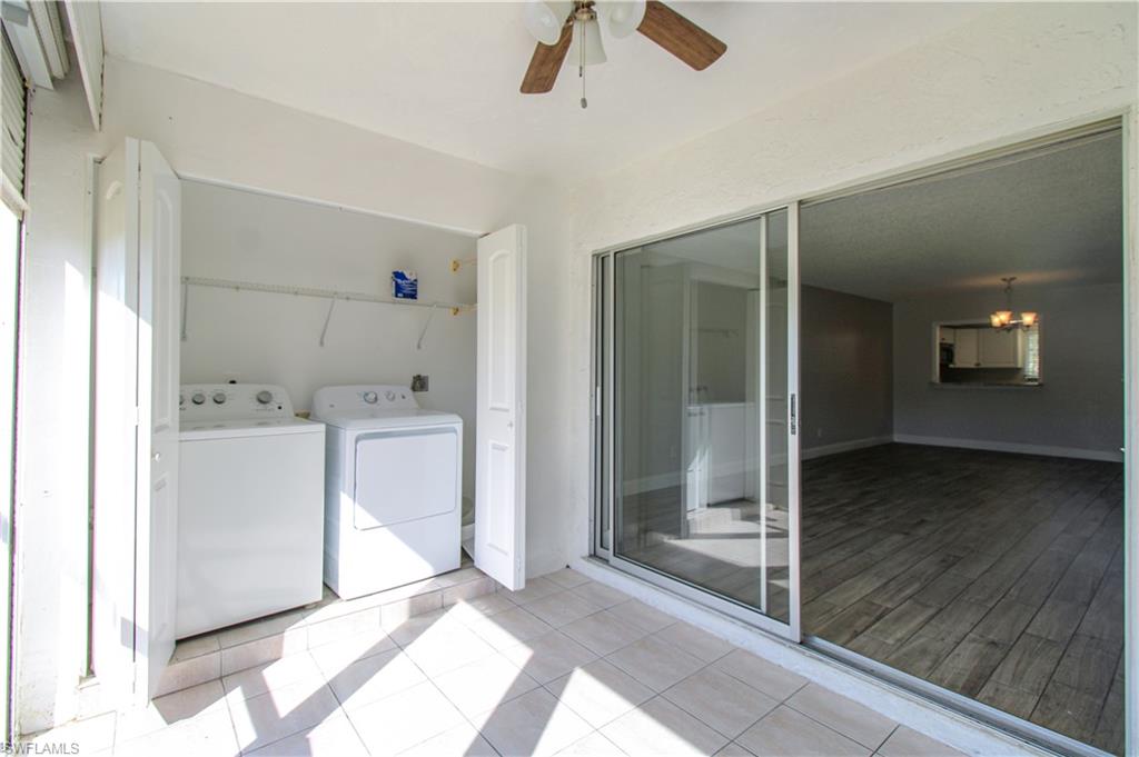 5635 Rattlesnake Hammock Road, Unit 102D Naples, FL 34113 - Photo 44 of 47 a view of a hallway with bathroom and wooden floor