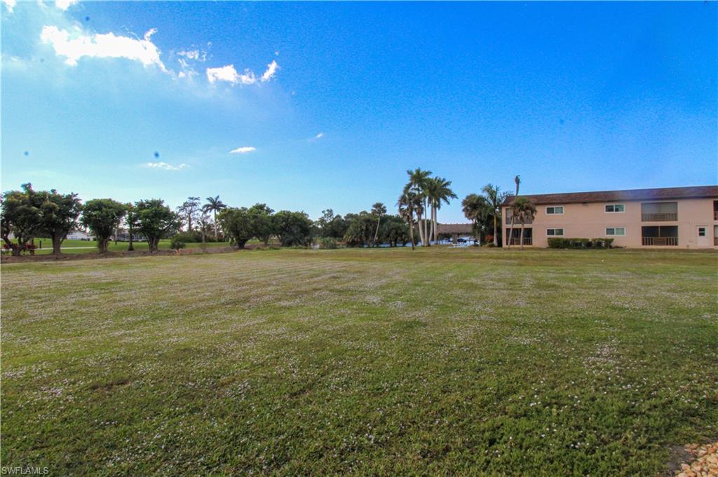 5635 Rattlesnake Hammock Road, Unit 102D Naples, FL 34113 - Photo 47 of 47 a view of a field with an outdoor space