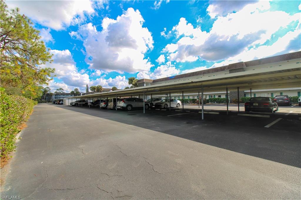 5635 Rattlesnake Hammock Road, Unit 102D Naples, FL 34113 - Photo 6 of 47 a view of a street with cars