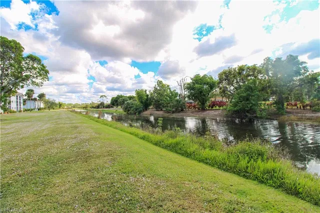 a view of a lake with a yard