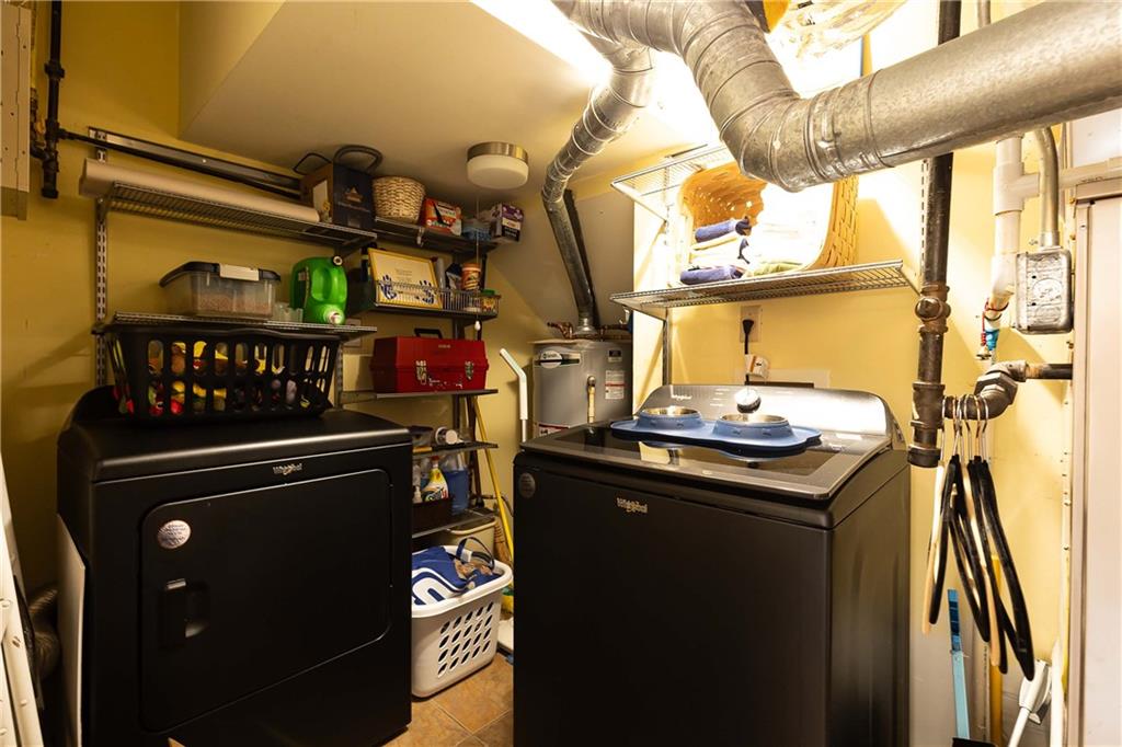 5 Middle Plantation Road Northwest, Unit 5 Atlanta, GA 30318 - Photo 17 of 33 a kitchen with a stove a sink and a table
