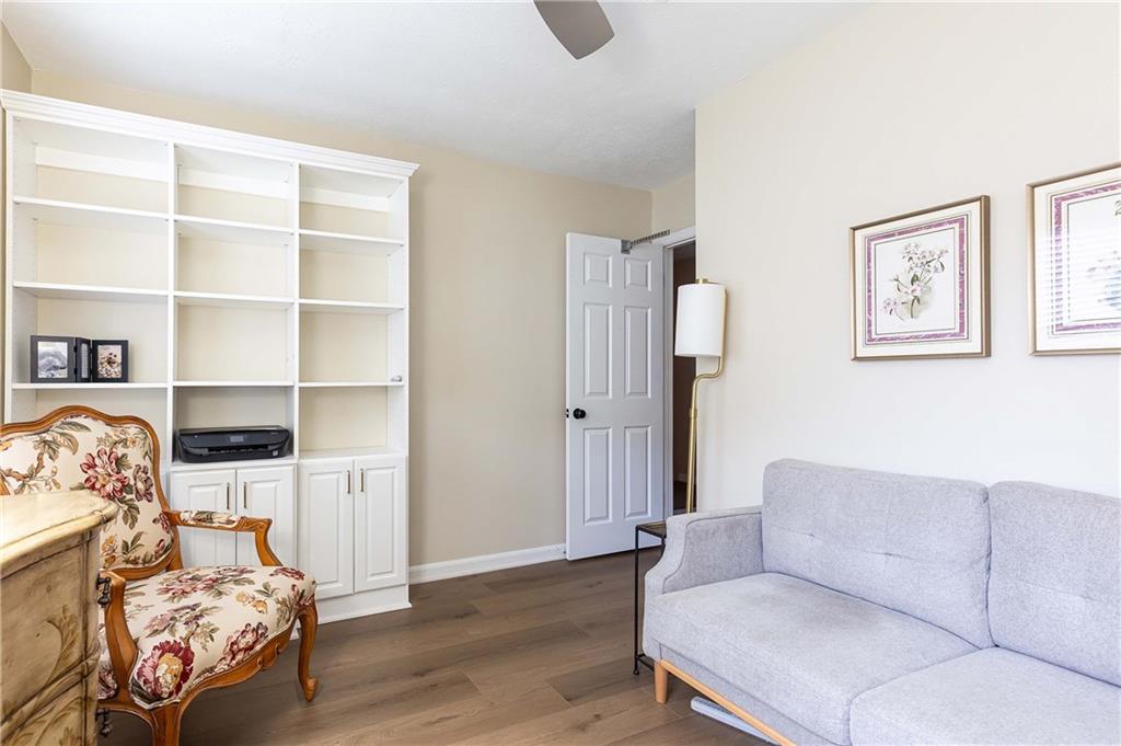 5 Middle Plantation Road Northwest, Unit 5 Atlanta, GA 30318 - Photo 22 of 33 a living room with furniture and a book shelf