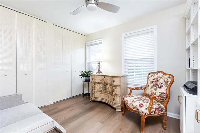 a bedroom with furniture and a window