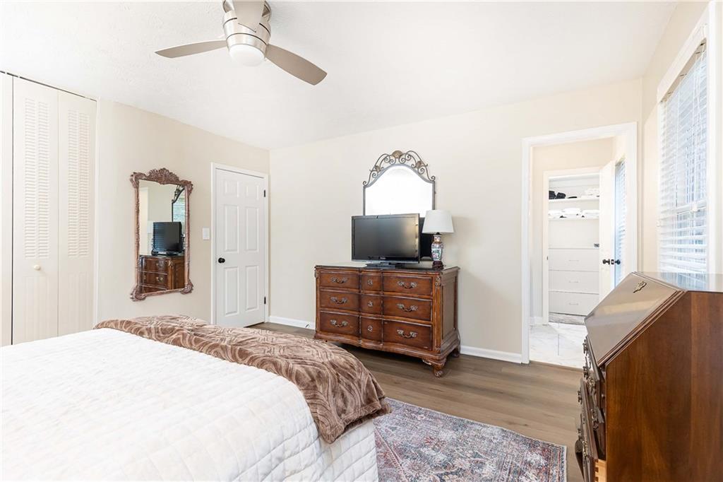 5 Middle Plantation Road Northwest, Unit 5 Atlanta, GA 30318 - Photo 26 of 33 a bedroom with a bed and a television