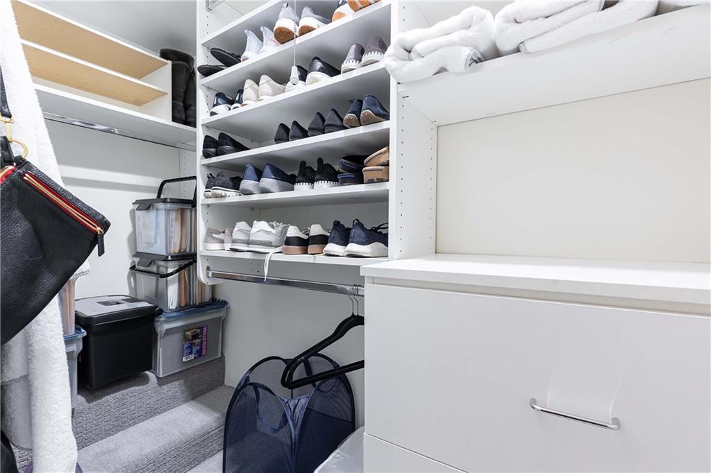 5 Middle Plantation Road Northwest, Unit 5 Atlanta, GA 30318 - Photo 29 of 33 a kitchen with stainless steel appliances a refrigerator and a stove top oven