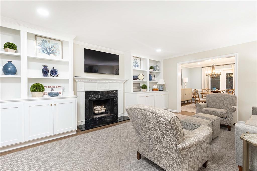 5 Middle Plantation Road Northwest, Unit 5 Atlanta, GA 30318 - Photo 5 of 33 a living room with furniture a flat screen tv and a fireplace