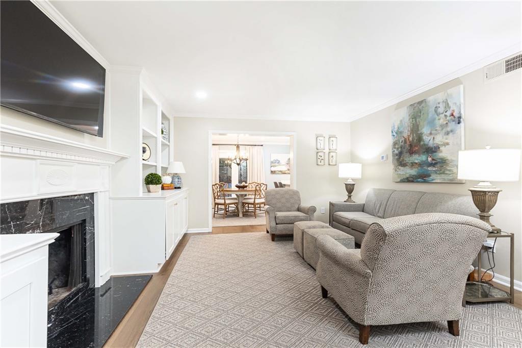 5 Middle Plantation Road Northwest, Unit 5 Atlanta, GA 30318 - Photo 7 of 33 a living room with furniture and a flat screen tv