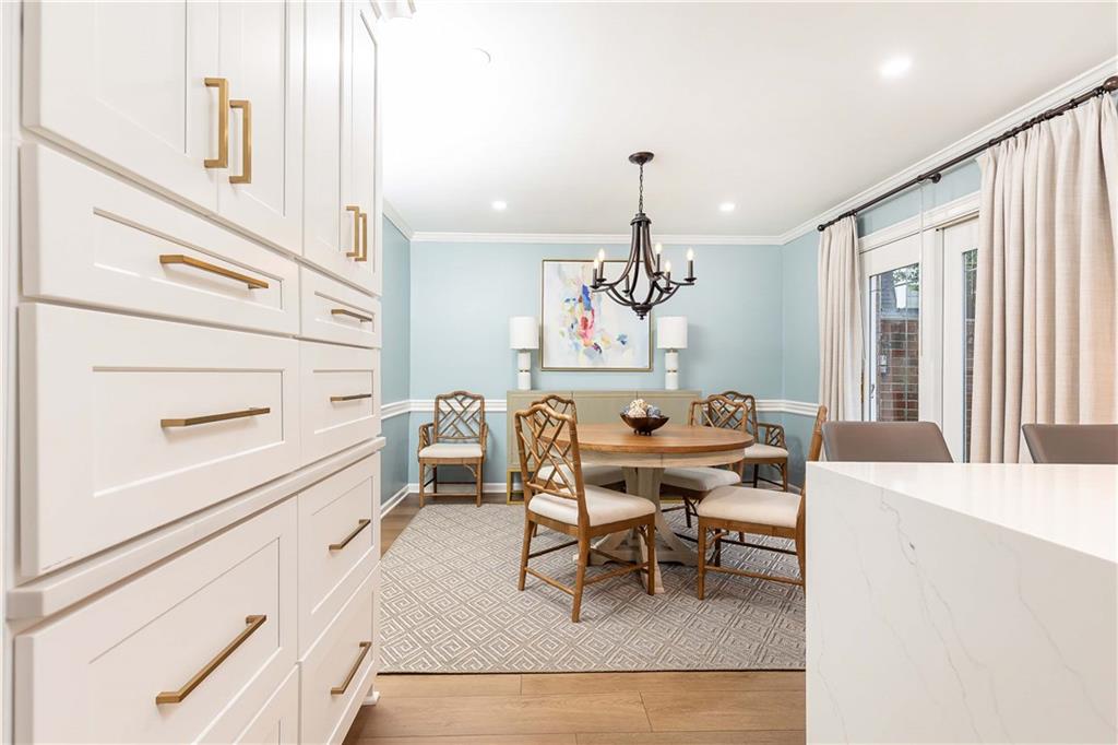 5 Middle Plantation Road Northwest, Unit 5 Atlanta, GA 30318 - Photo 9 of 33 a dining room with furniture and chandelier