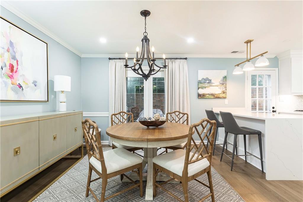 5 Middle Plantation Road Northwest, Unit 5 Atlanta, GA 30318 - Photo 10 of 33 a view of a dining room with furniture window and wooden floor