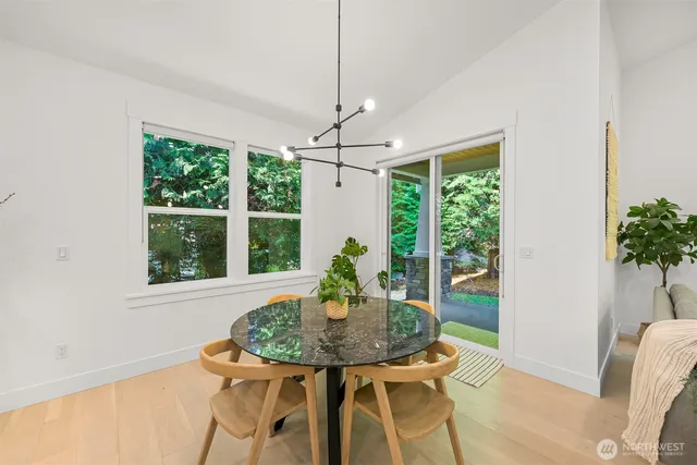 a view of a dining room with furniture window and outside view