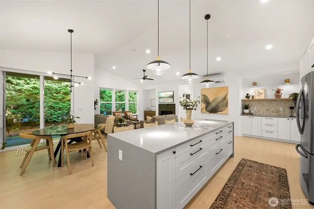 a view of center kitchen island with furniture and floor
