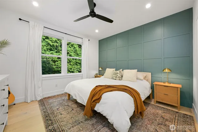 a bedroom with a bed and a window