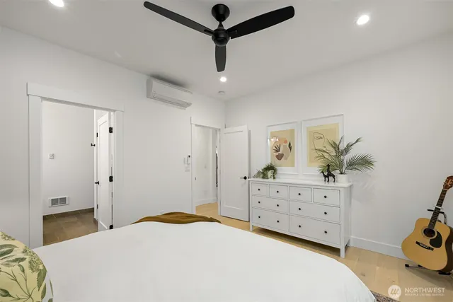 a bedroom with a bed and a dresser