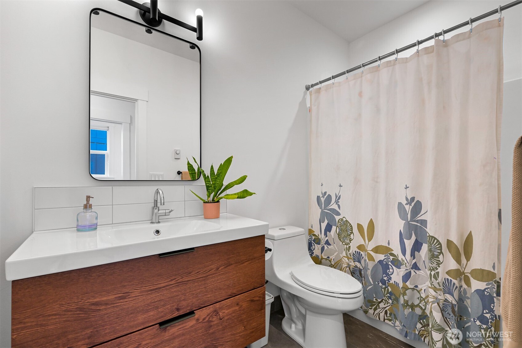 5440 Tanager Road Blaine, WA 98230 - Photo 26 of 40 a bathroom with a sink vanity mirror and toilet