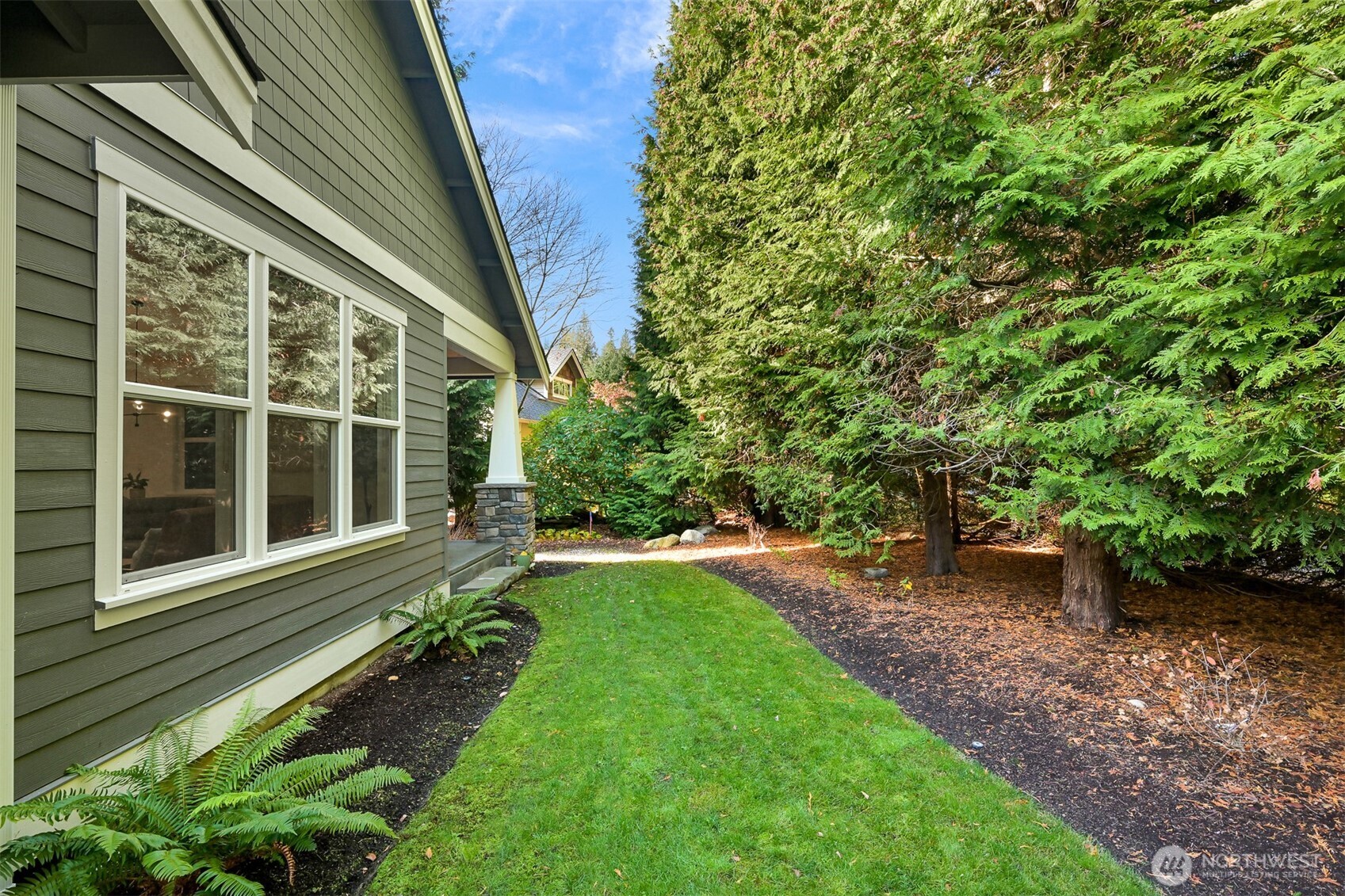 5440 Tanager Road Blaine, WA 98230 - Photo 33 of 40 a view of a backyard with potted plants and large tree