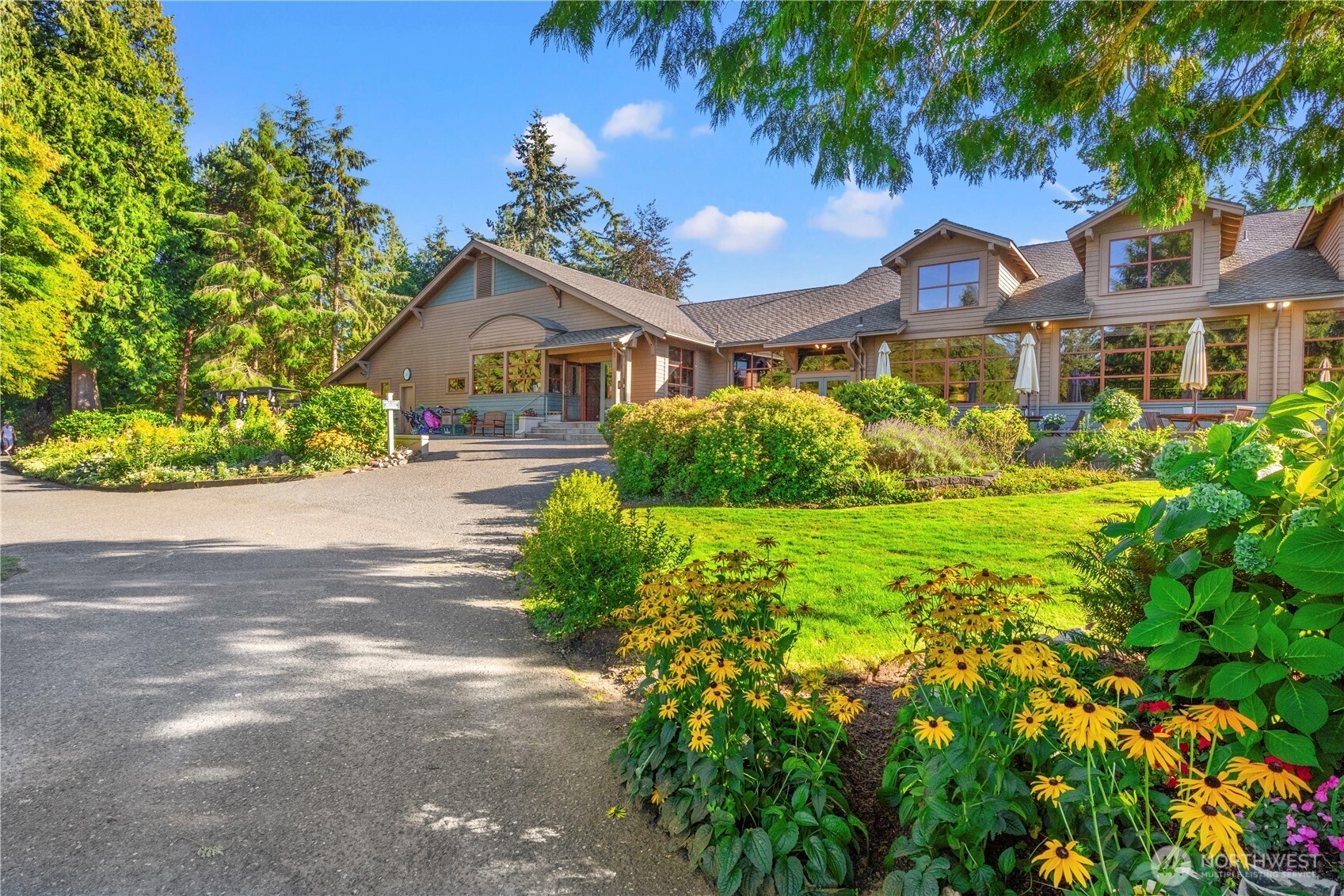 5440 Tanager Road Blaine, WA 98230 - Photo 37 of 40 a front view of a house with a yard and potted plants