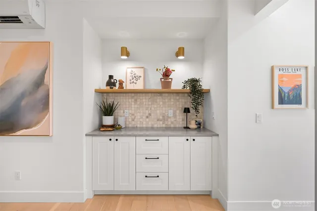 a view of cabinets and wooden floor