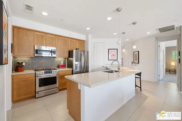 a living room with furniture a table and a large window