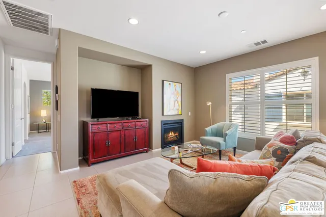 a view of a chairs and table in the balcony