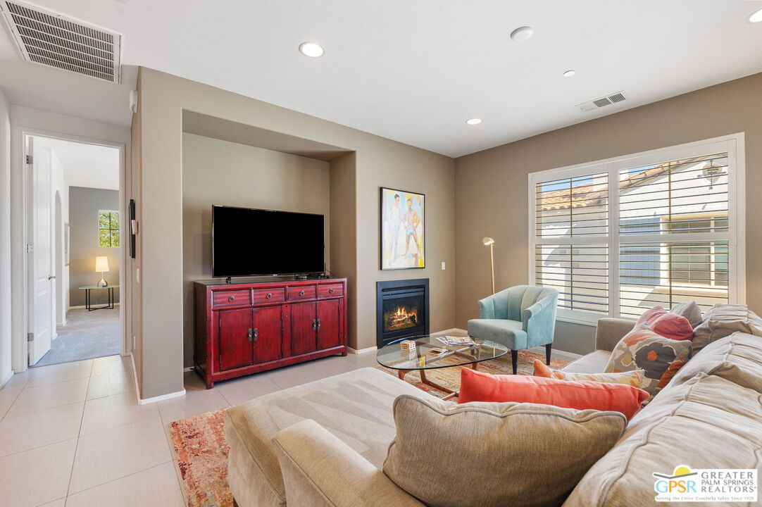 491 Terra Vita Palm Springs, CA 92262 - Photo 15 of 25 a living room with furniture and a flat screen tv