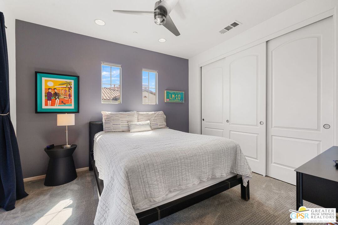 491 Terra Vita Palm Springs, CA 92262 - Photo 21 of 25 a bedroom with a bed and a window