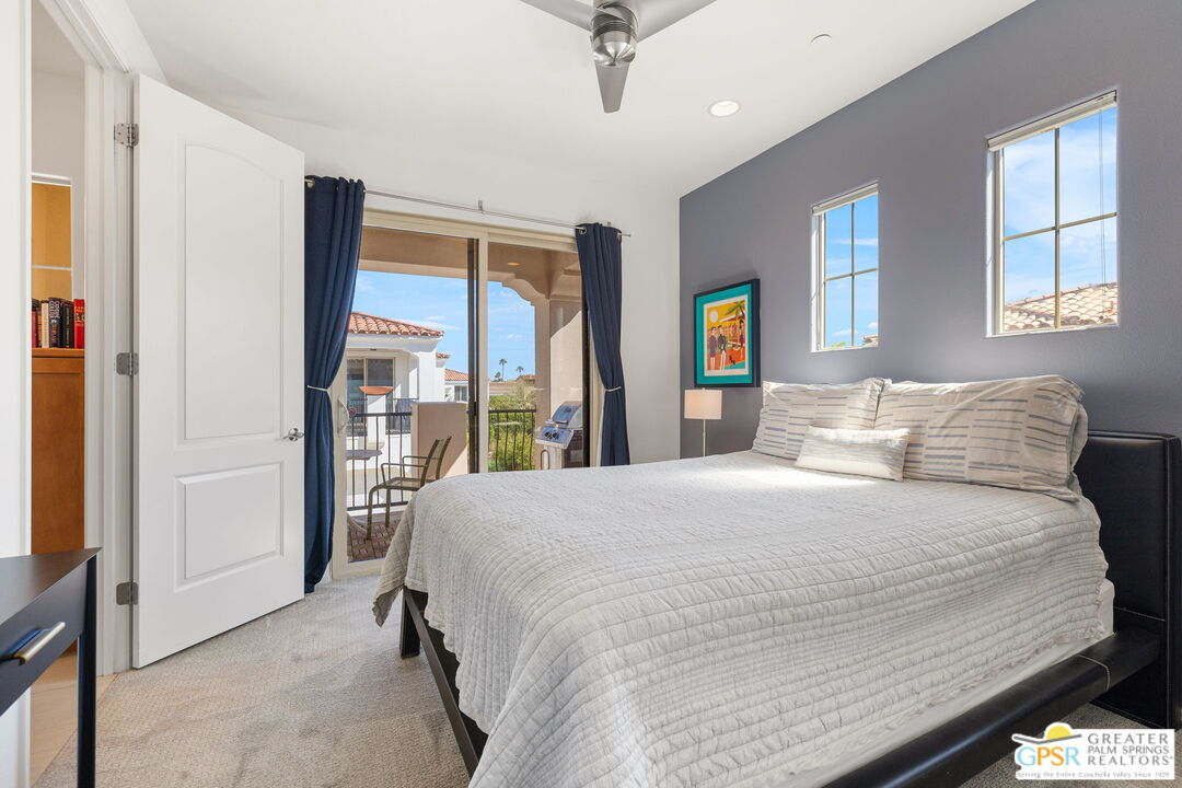 491 Terra Vita Palm Springs, CA 92262 - Photo 22 of 25 a bedroom with a large bed and a window