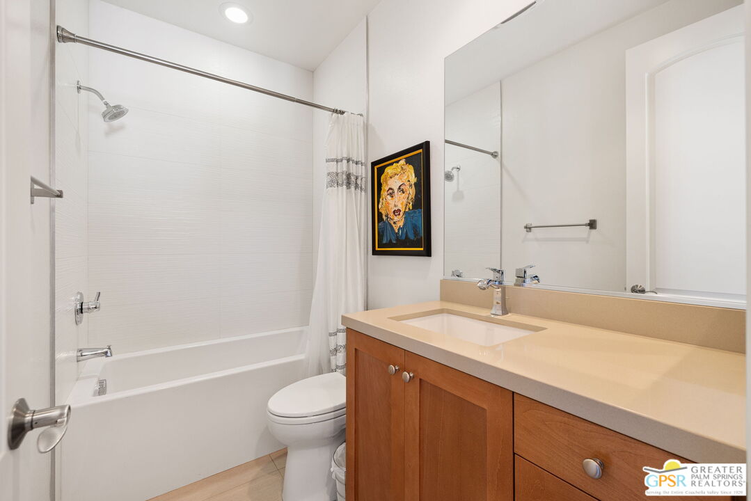 491 Terra Vita Palm Springs, CA 92262 - Photo 23 of 25 a bathroom with a sink toilet and shower