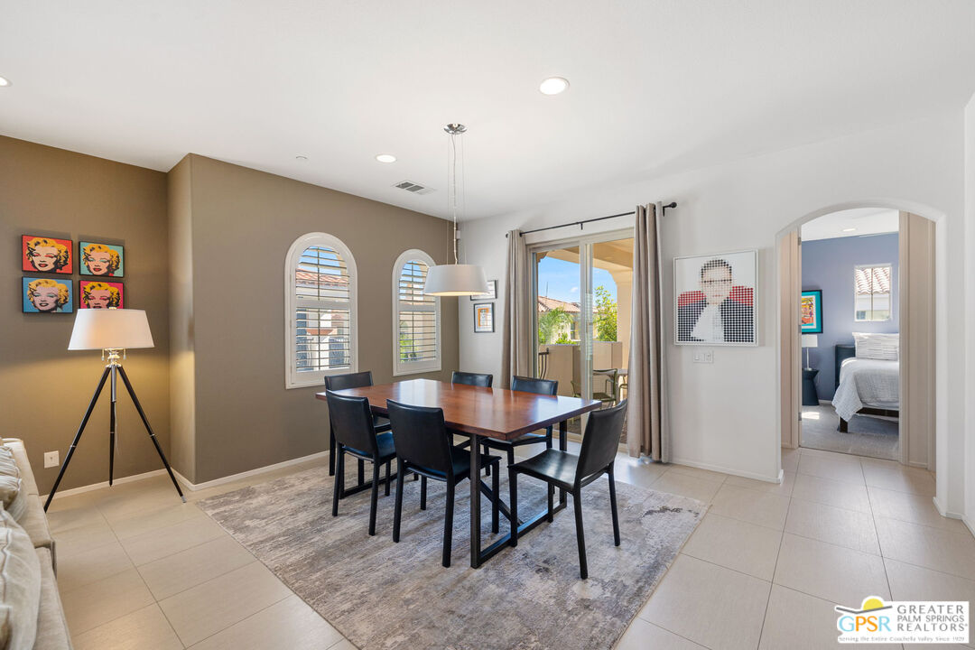 491 Terra Vita Palm Springs, CA 92262 - Photo 7 of 25 a view of a dining room with furniture and wooden floor