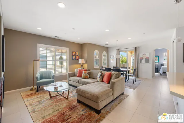 a large white kitchen with stainless steel appliances granite countertop a stove and a refrigerator