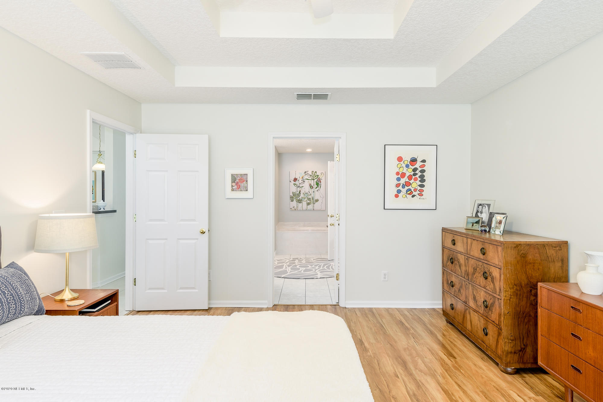 1261 Ribbon Road Jacksonville, FL 32259 - Photo 17 of 33 a bedroom with a bed and wooden floor