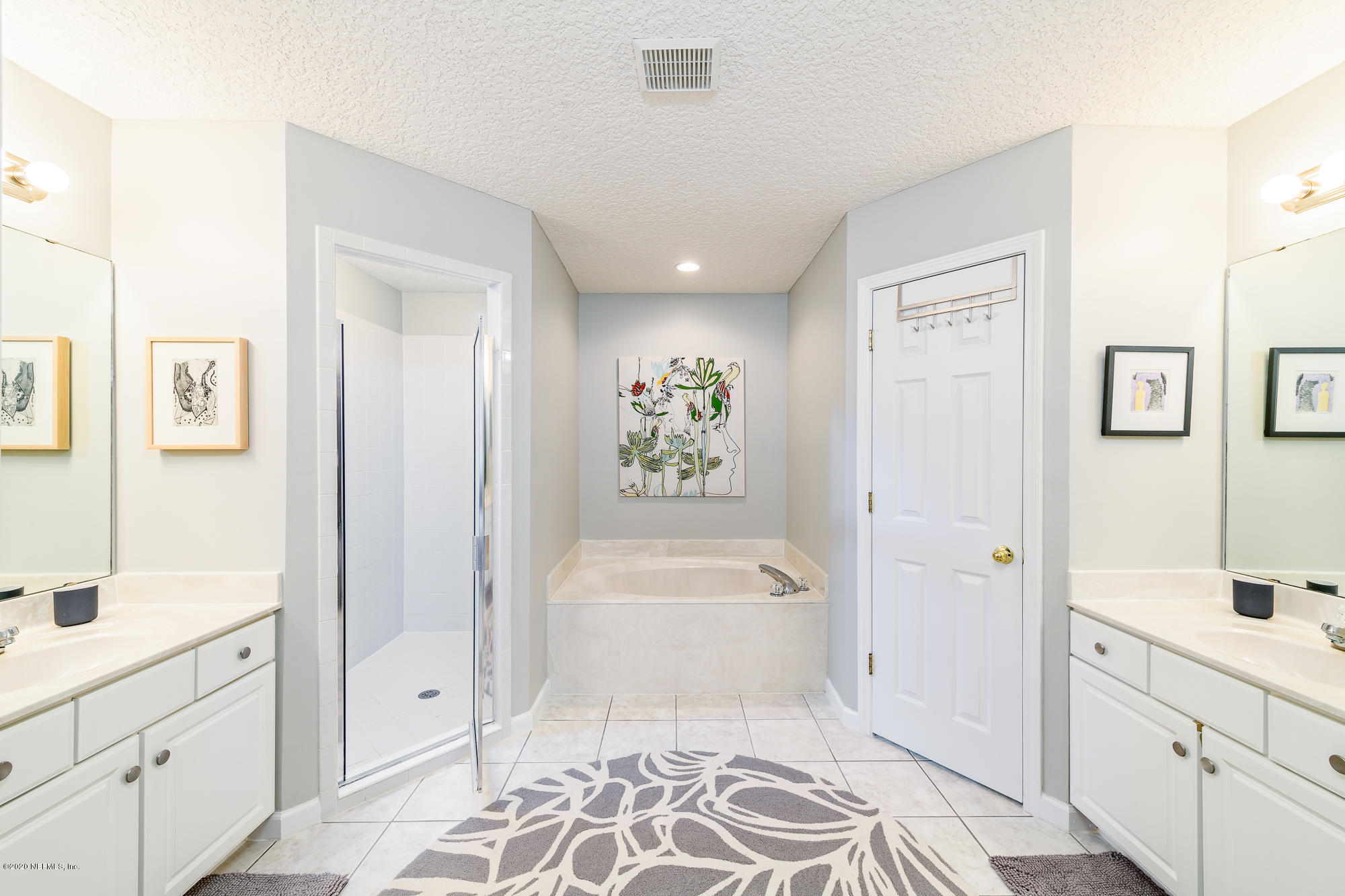 1261 Ribbon Road Jacksonville, FL 32259 - Photo 18 of 33 a spacious bathroom with a tub sink and mirror