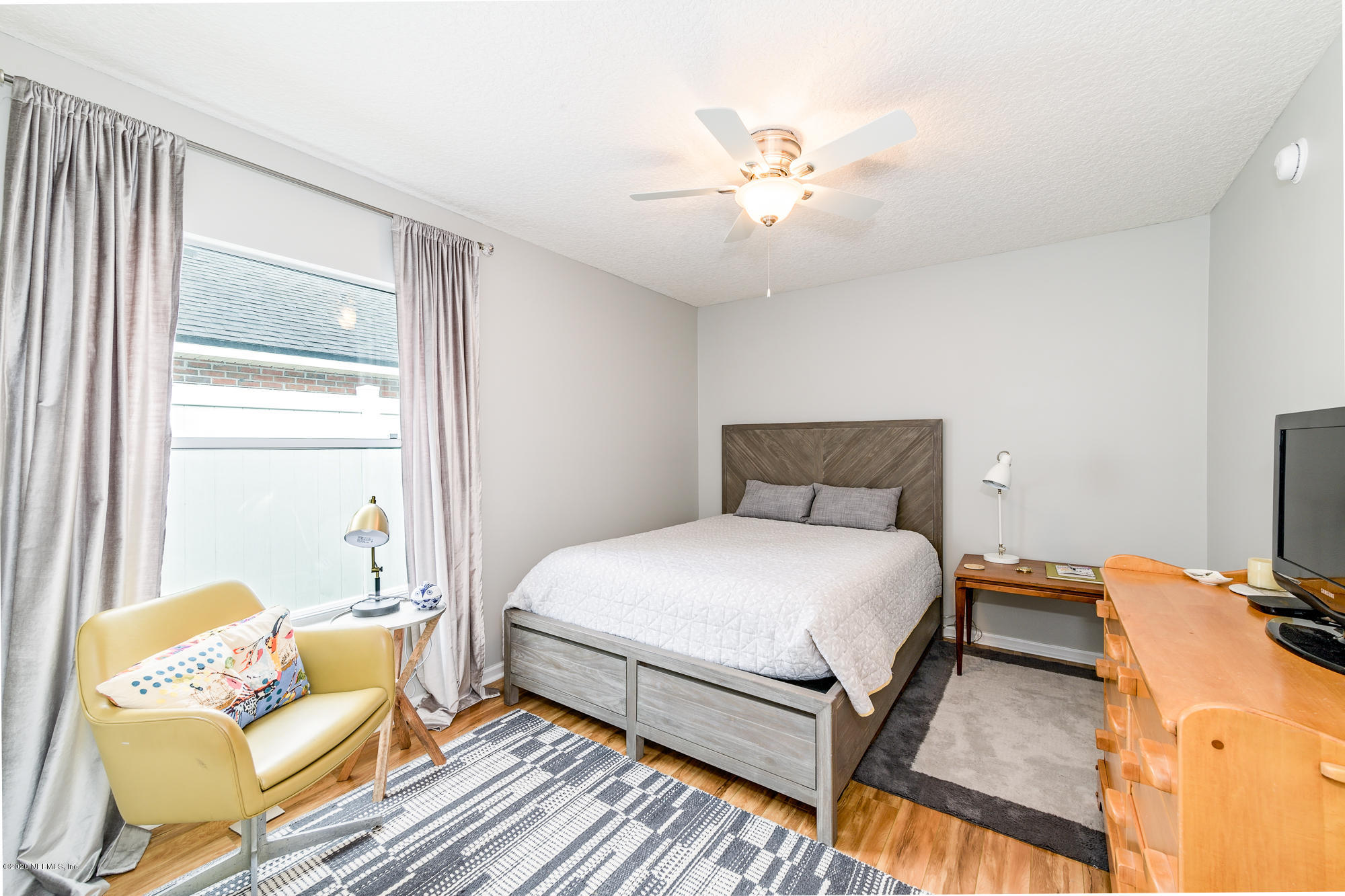1261 Ribbon Road Jacksonville, FL 32259 - Photo 21 of 33 a bedroom with a bed and wooden floor