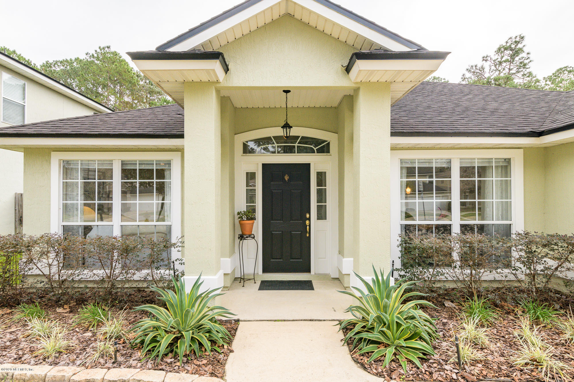1261 Ribbon Road Jacksonville, FL 32259 - Photo 4 of 33 a front view of a house with a yard