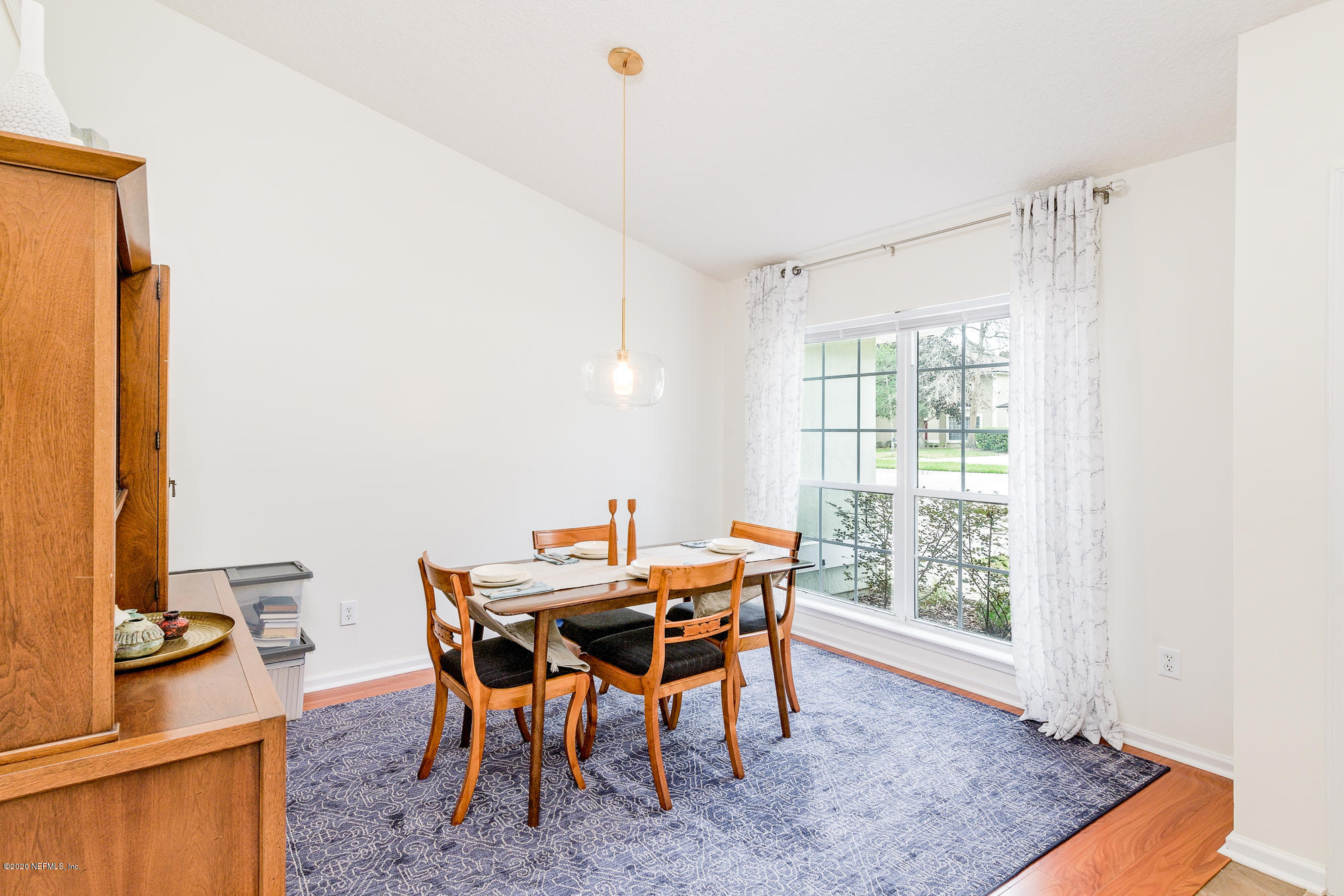 1261 Ribbon Road Jacksonville, FL 32259 - Photo 7 of 33 a dining room with furniture and wooden floor