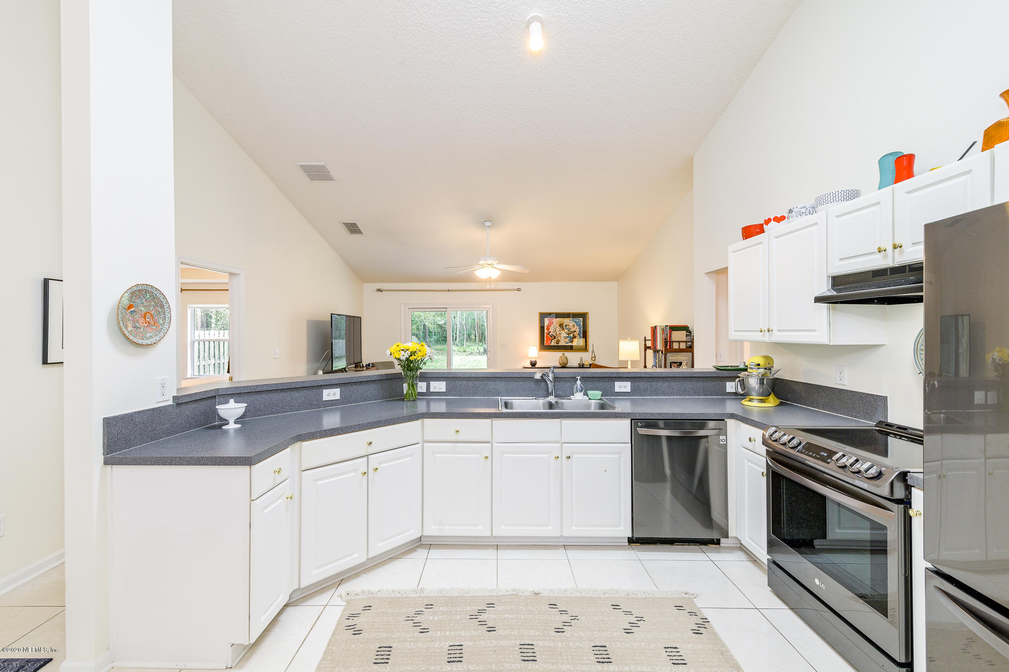 1261 Ribbon Road Jacksonville, FL 32259 - Photo 9 of 33 a kitchen with stainless steel appliances granite countertop a sink and cabinets