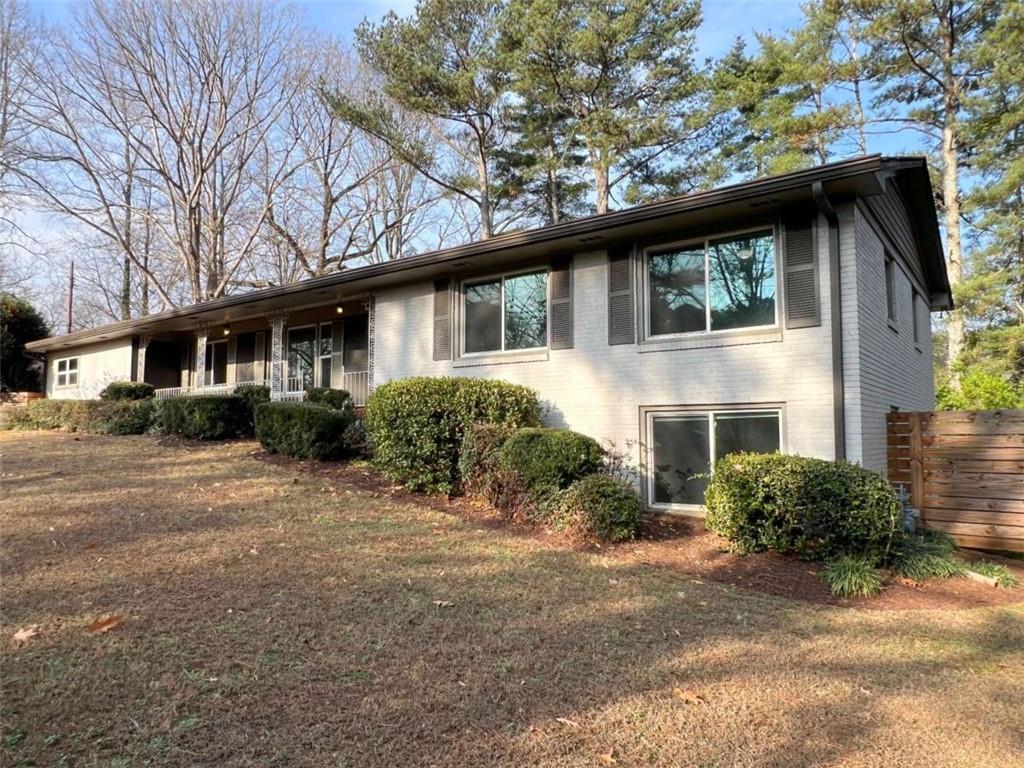 3158 Shabromat Way Atlanta, GA 30341 - Photo 1 of 47 a front view of a house with a garden