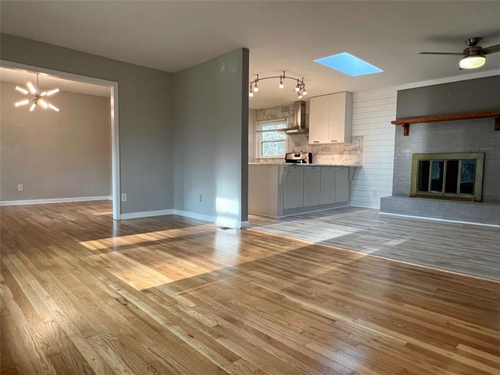 3158 Shabromat Way Atlanta, GA 30341 - Photo 22 of 47 a view of a kitchen with a sink and a fireplace