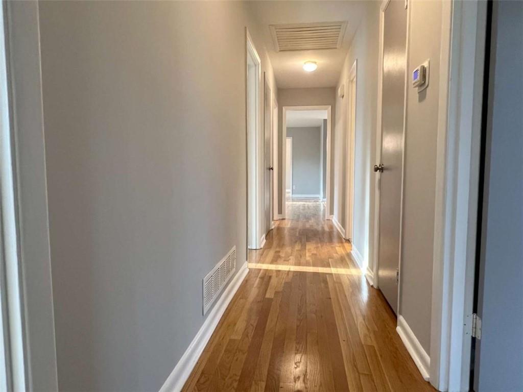 3158 Shabromat Way Atlanta, GA 30341 - Photo 26 of 47 a view of a hallway with wooden floor