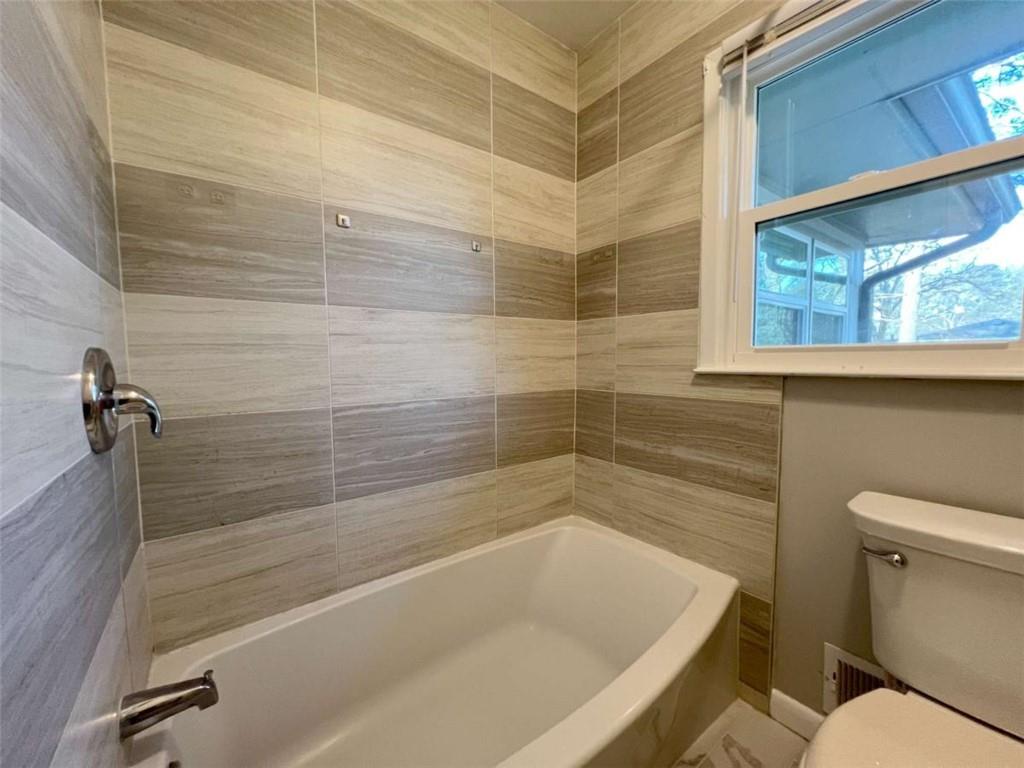 3158 Shabromat Way Atlanta, GA 30341 - Photo 27 of 47 a bathroom with a bathtub and a shower