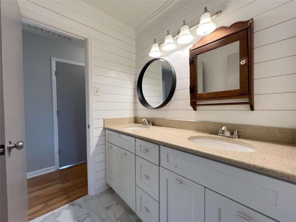3158 Shabromat Way Atlanta, GA 30341 - Photo 28 of 47 a bathroom with a double vanity sink and a mirror