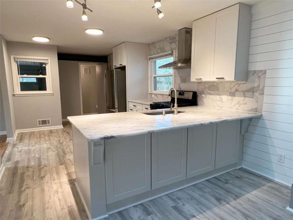 3158 Shabromat Way Atlanta, GA 30341 - Photo 30 of 47 a kitchen with a sink cabinets and wooden floor