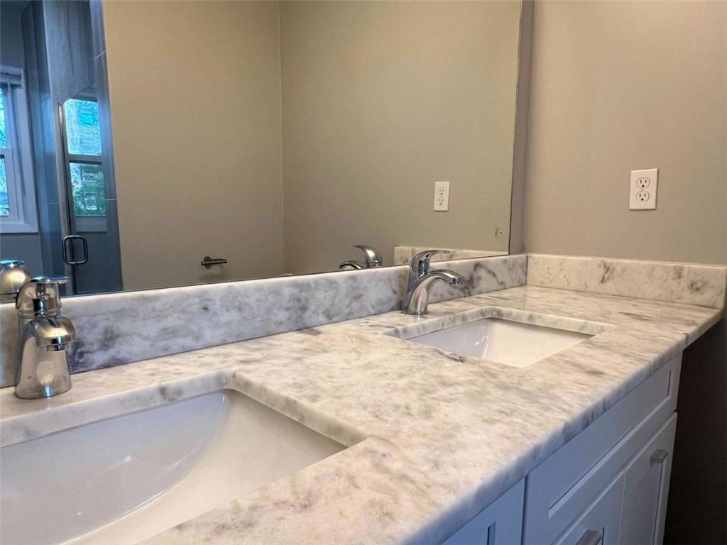 3158 Shabromat Way Atlanta, GA 30341 - Photo 34 of 47 a bathroom with a granite countertop sink and a mirror