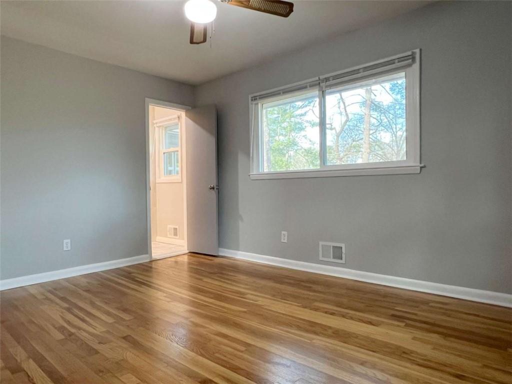 3158 Shabromat Way Atlanta, GA 30341 - Photo 41 of 47 a view of an empty room with wooden floor and a window