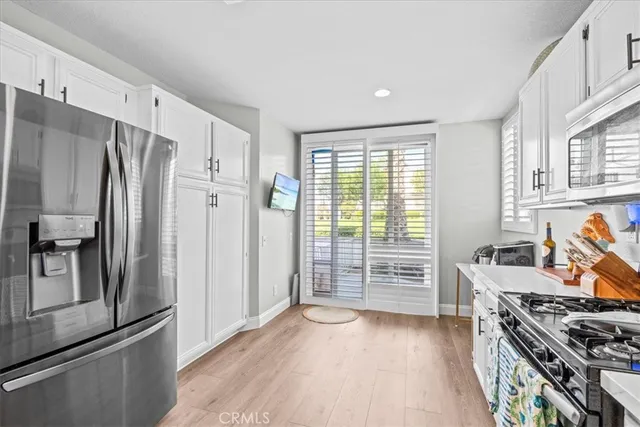 a kitchen with stainless steel appliances a stove and a refrigerator