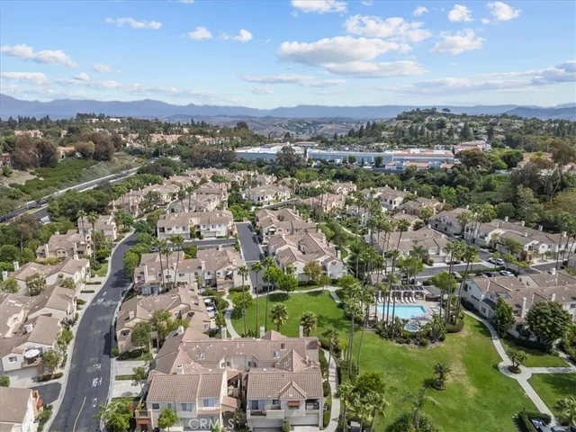 an aerial view of city and lake