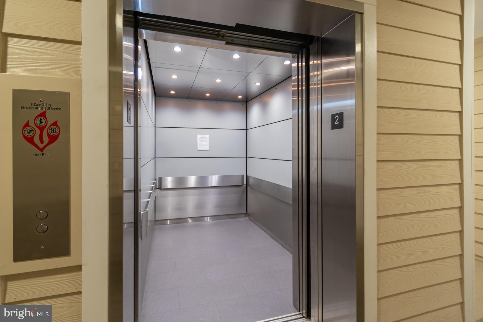 1600 Spring Gate Dr., Unit 2207 McLean, VA 22102 - Photo 29 of 32 a bathroom with a glass shower door and a mirror