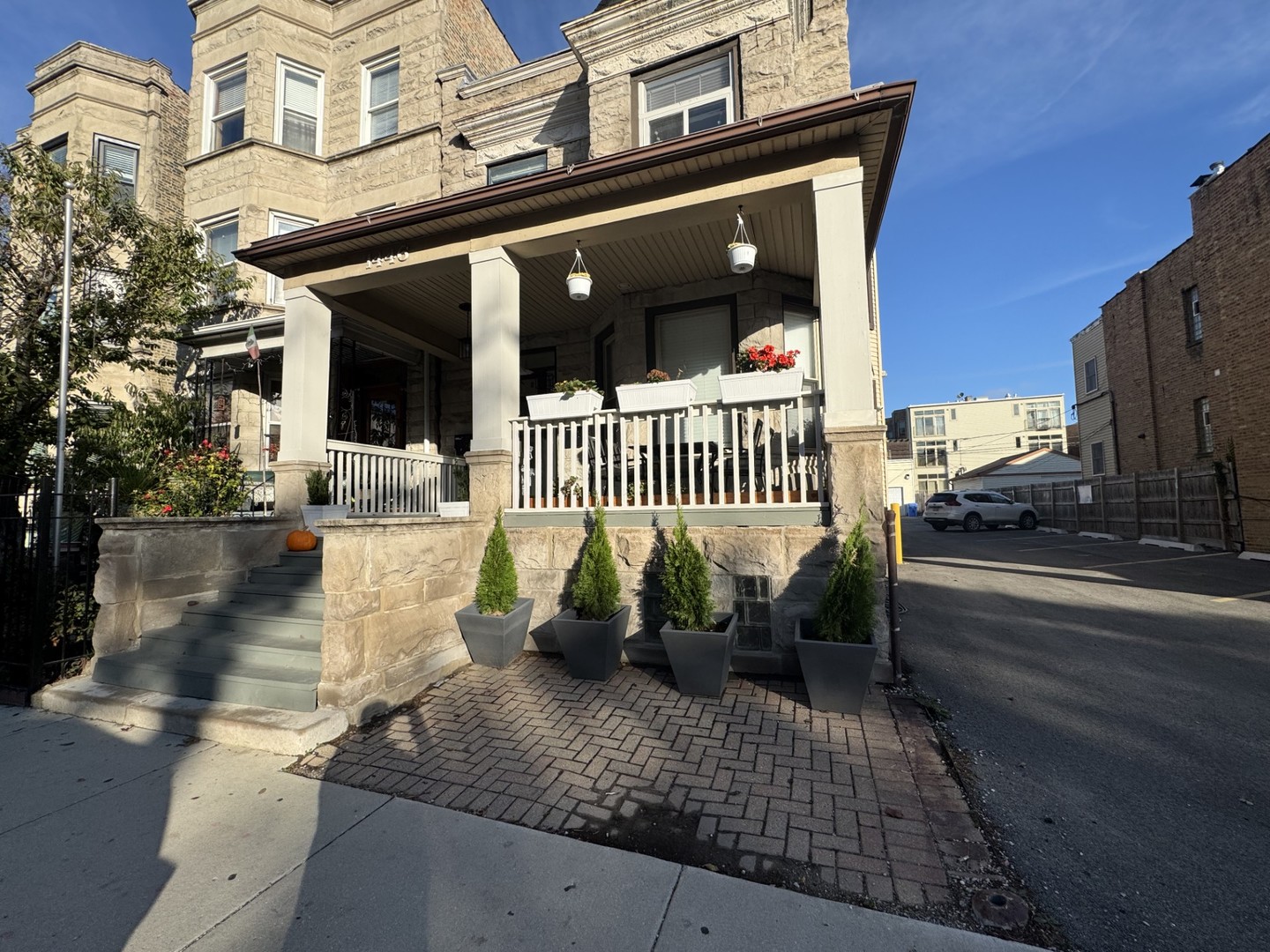 a view of a house with a large window and wooden floor